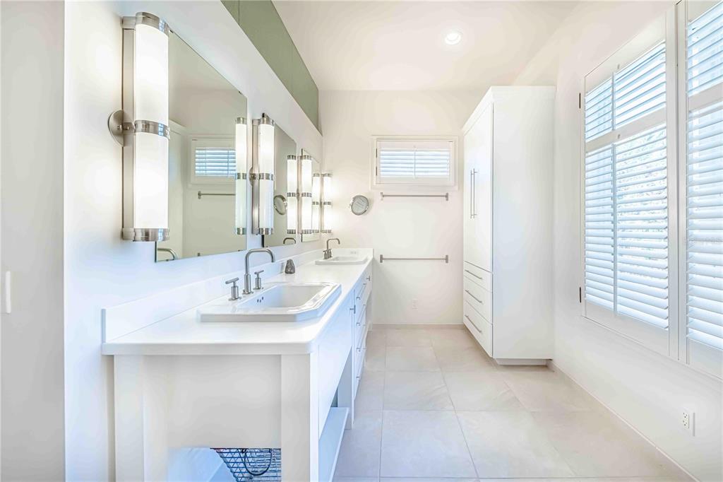 16250 Sunset Pines Circle Boca Grande, FL 33921 - Photo 20 of 48 a bathroom with a sink and a mirror