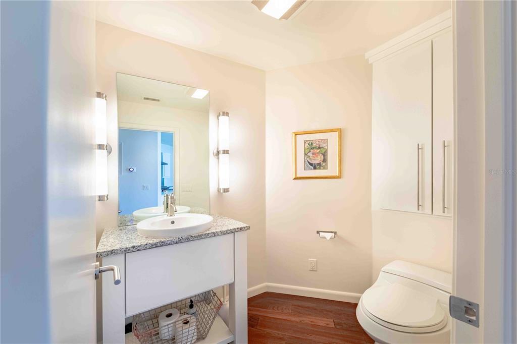 16250 Sunset Pines Circle Boca Grande, FL 33921 - Photo 23 of 48 a bathroom with a sink a toilet and shower
