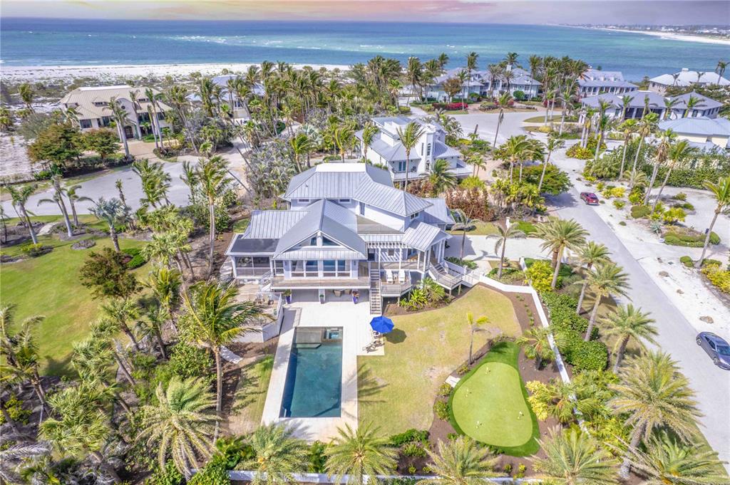 16250 Sunset Pines Circle Boca Grande, FL 33921 - Photo 44 of 48 an aerial view of a swimming pool with a yard