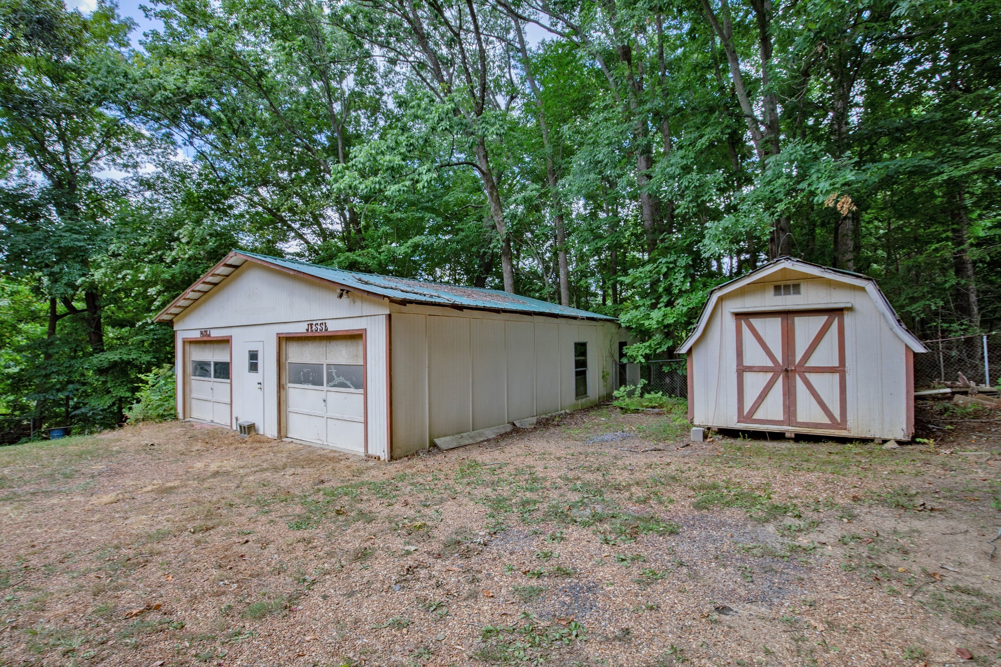 7498 Swift Road Greenbrier, TN 37073 - Photo 50 of 69 a view of a barn house with a yard and large tree