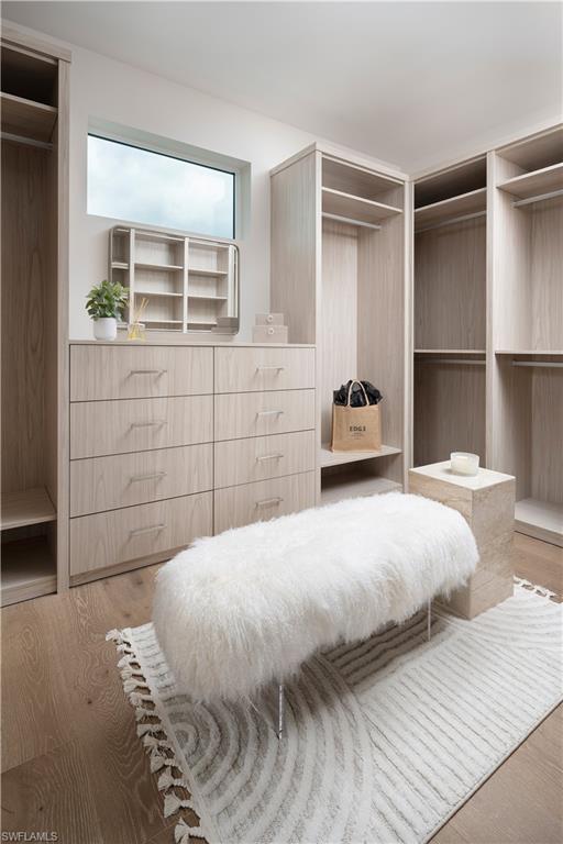141 Channel Drive Naples, FL 34108 - Photo 19 of 28 Spacious closet featuring wood finished floors