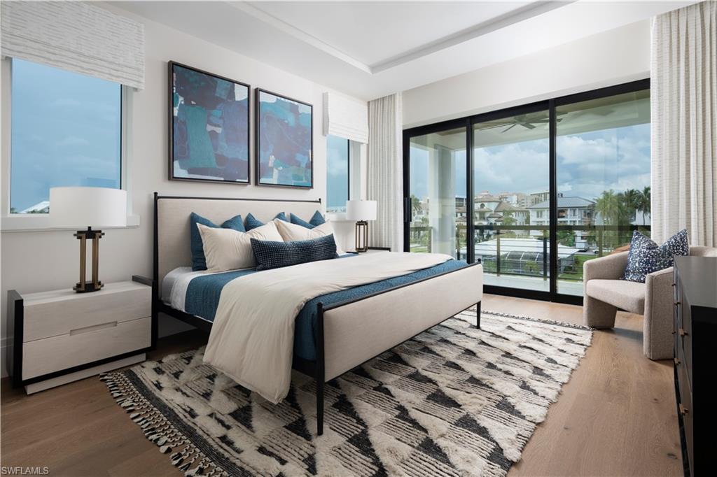141 Channel Drive Naples, FL 34108 - Photo 23 of 28 Bedroom featuring access to outside and wood finished floors