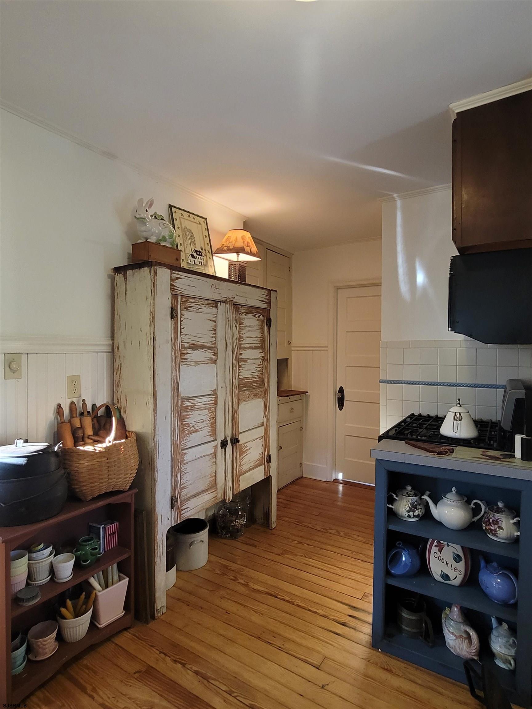 804 2nd Street Somers Point, NJ 08244 - Photo 11 of 29 a view of a workspace with furniture and wooden floor