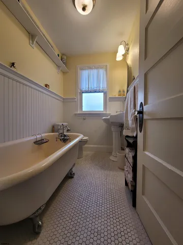 a bathroom with a sink a bathtub and a shower