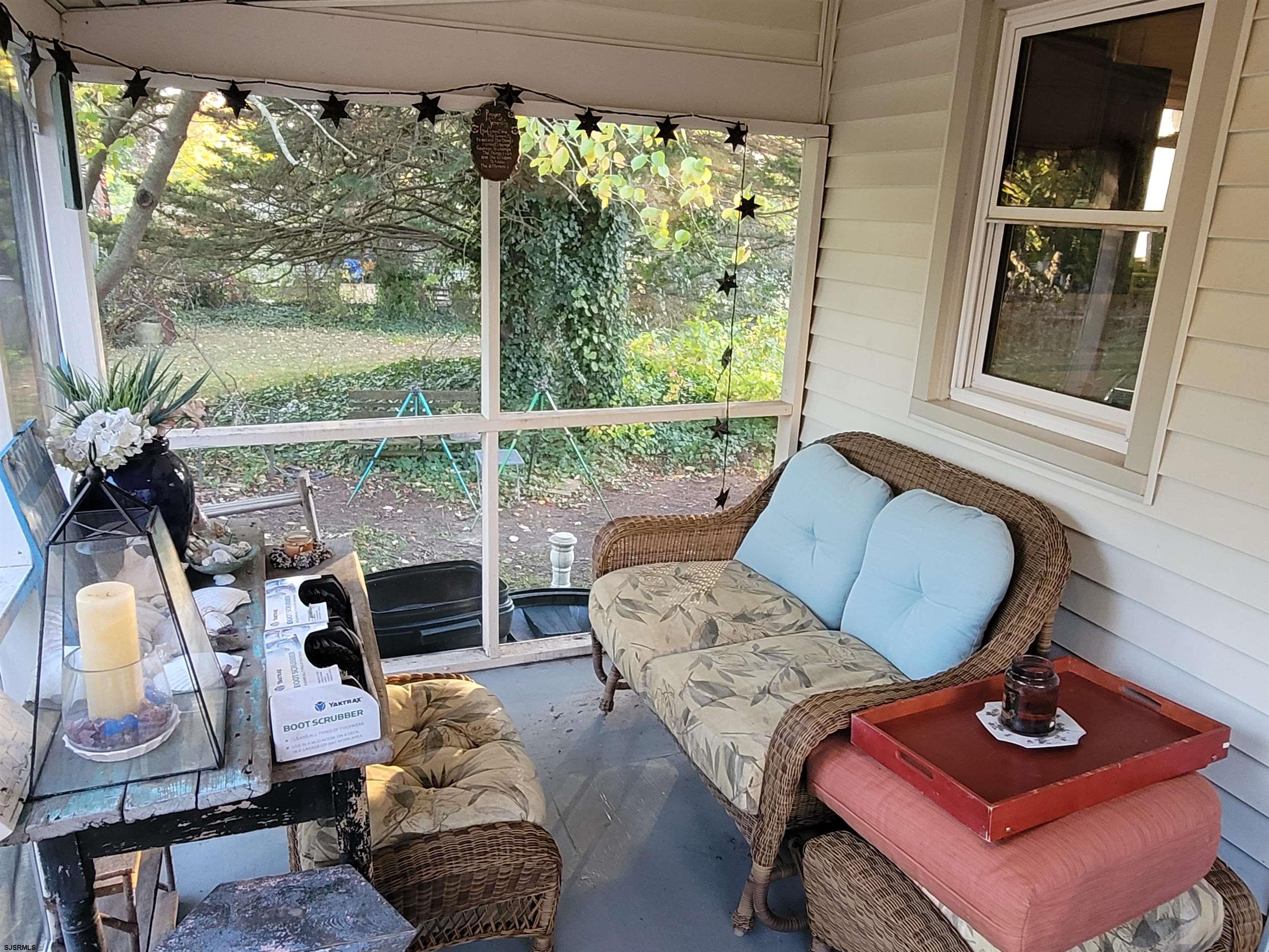 804 2nd Street Somers Point, NJ 08244 - Photo 21 of 29 a living room with furniture and a floor to ceiling window