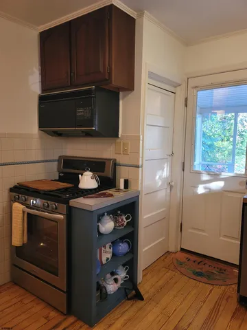a kitchen with a stove and a microwave