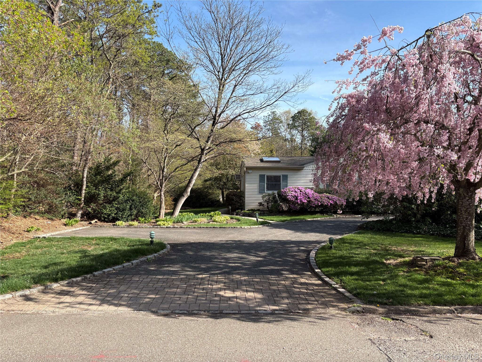 54 Old Brook Road Dix Hills, NY 11746 - Photo 12 of 15 a view of a brick house with a big yard and large trees