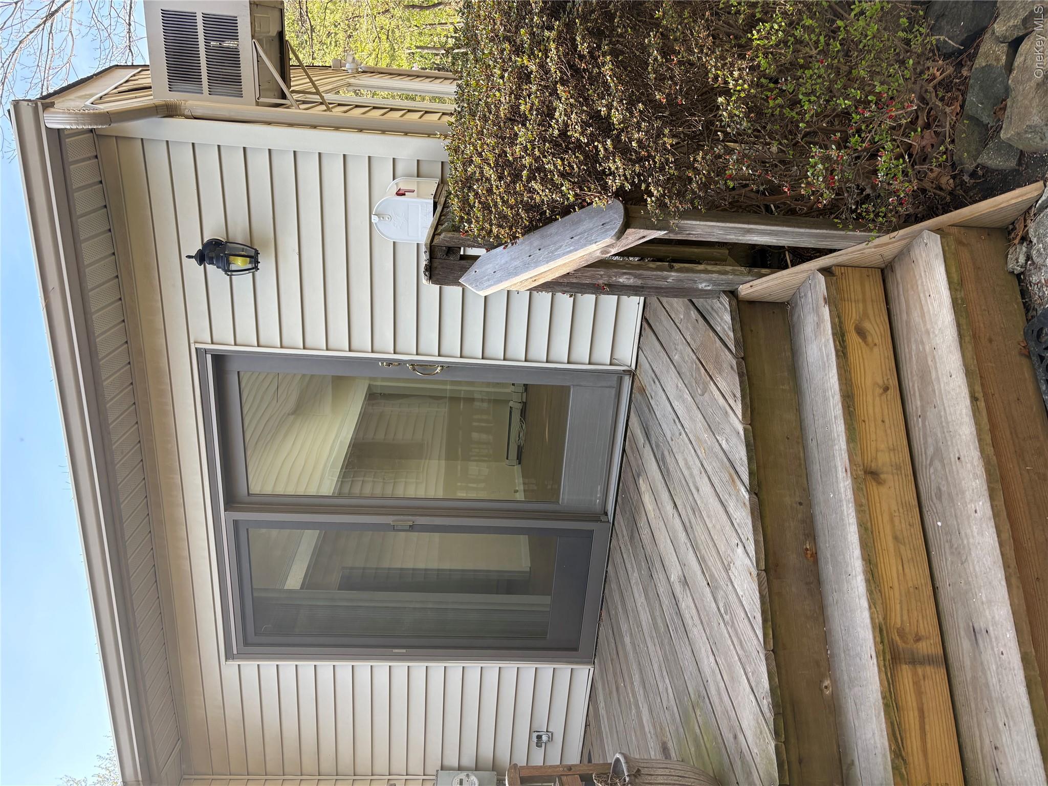 54 Old Brook Road Dix Hills, NY 11746 - Photo 15 of 15 a view of outdoor space and front door of house