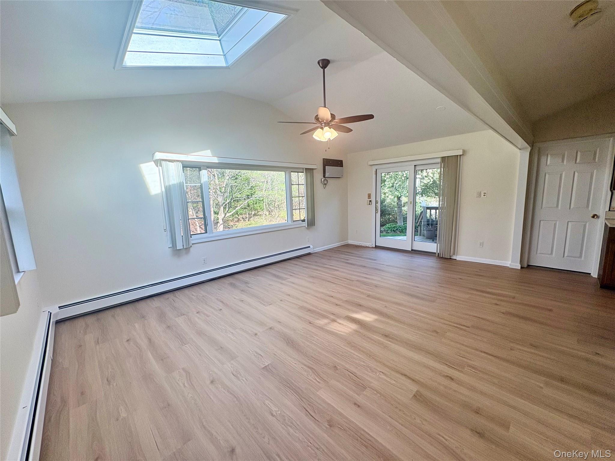 54 Old Brook Road Dix Hills, NY 11746 - Photo 2 of 15 wooden floor in an empty room with a window