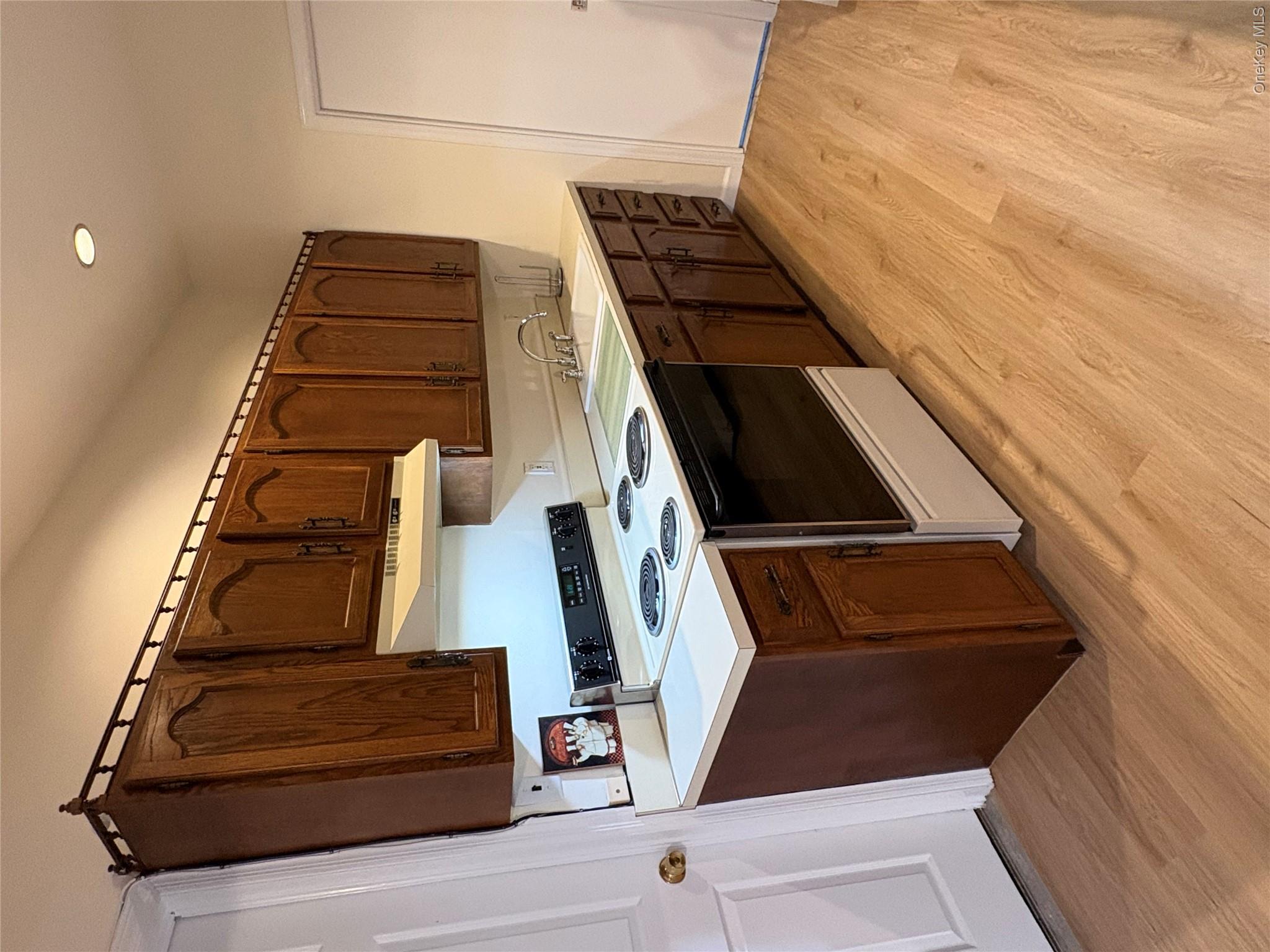 54 Old Brook Road Dix Hills, NY 11746 - Photo 8 of 15 a kitchen with a sink and a stove top oven