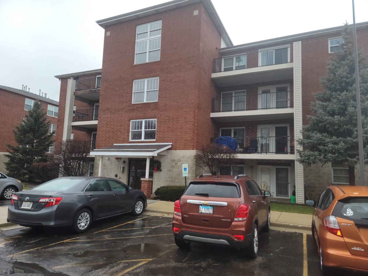 237 North Mill Road, Unit 3 Addison, IL 60101 - Photo 1 of 23 a front view of a house with parking space