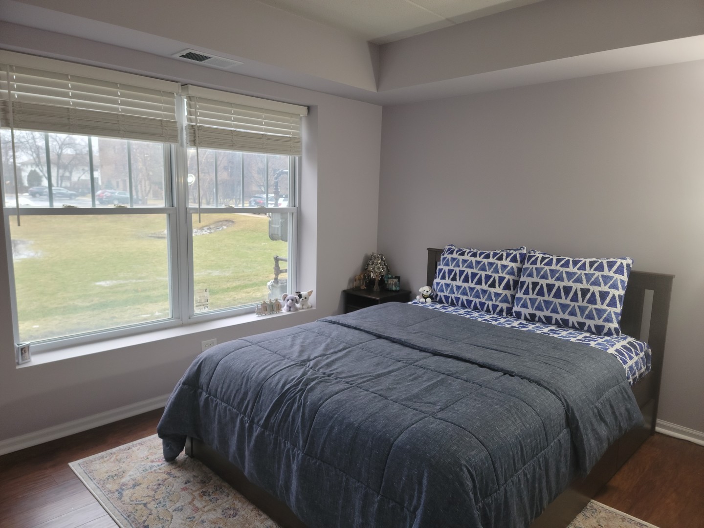 237 North Mill Road, Unit 3 Addison, IL 60101 - Photo 14 of 23 a bed sitting in a bedroom next to a window