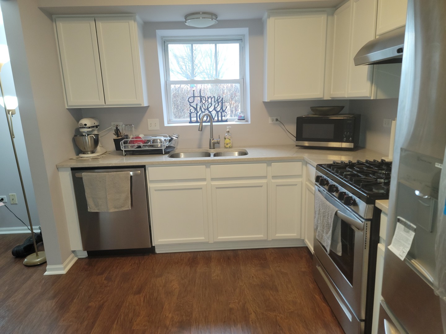 237 North Mill Road, Unit 3 Addison, IL 60101 - Photo 17 of 23 a kitchen with a sink stove and cabinets