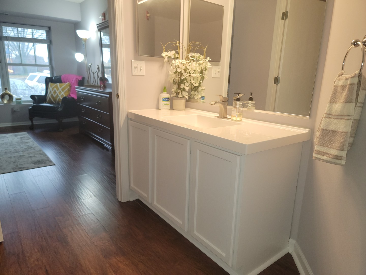237 North Mill Road, Unit 3 Addison, IL 60101 - Photo 19 of 23 a en suite bathroom with a sink and a mirror