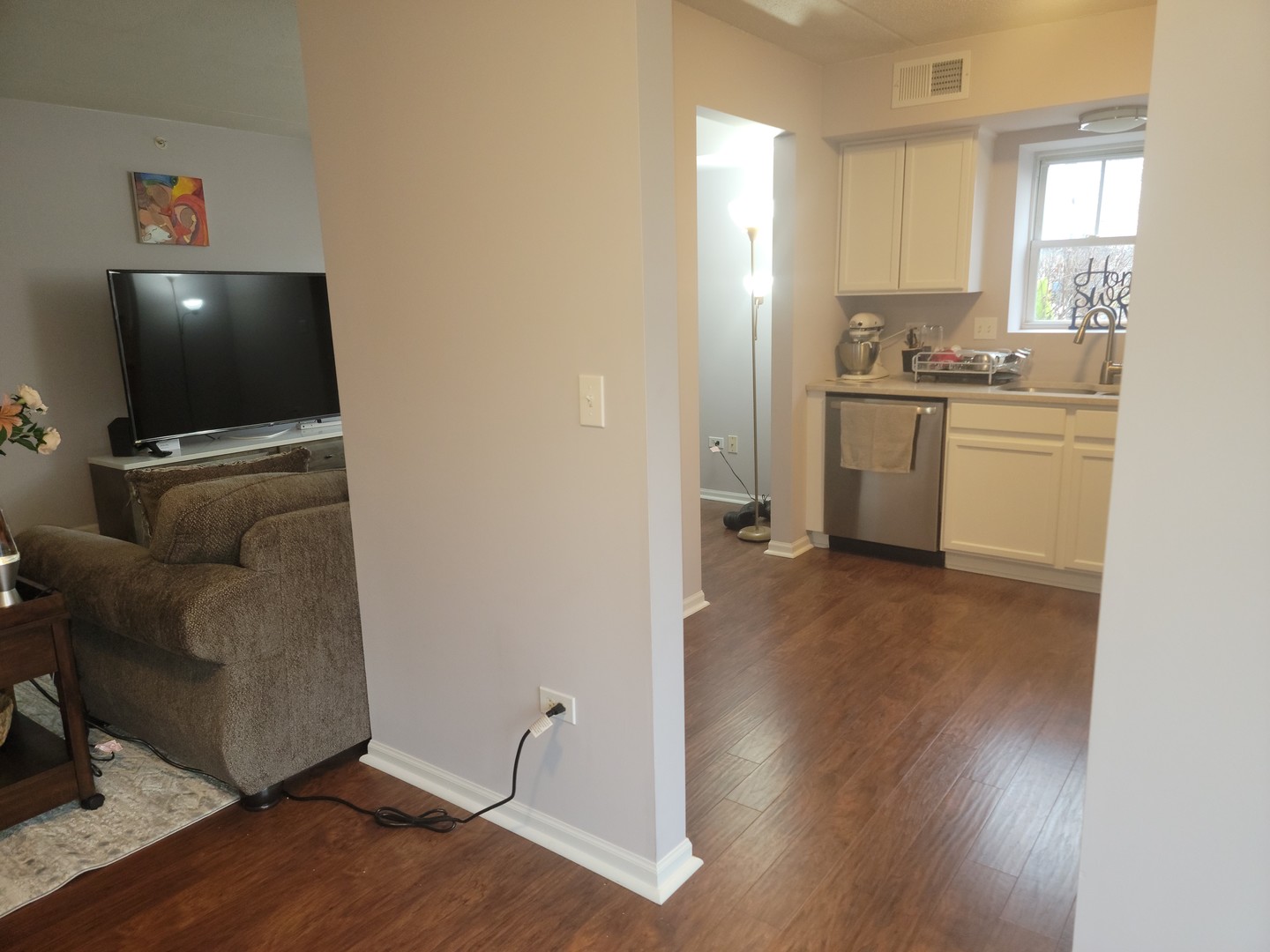 237 North Mill Road, Unit 3 Addison, IL 60101 - Photo 21 of 23 a view of kitchen and wooden floor