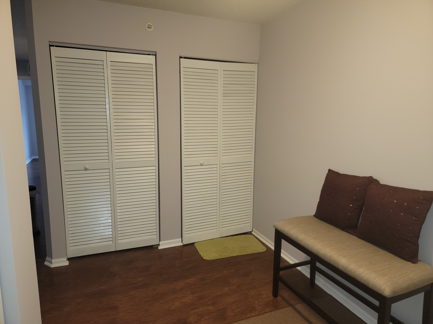 237 North Mill Road, Unit 3 Addison, IL 60101 - Photo 22 of 23 a blue chair sitting in front of a room