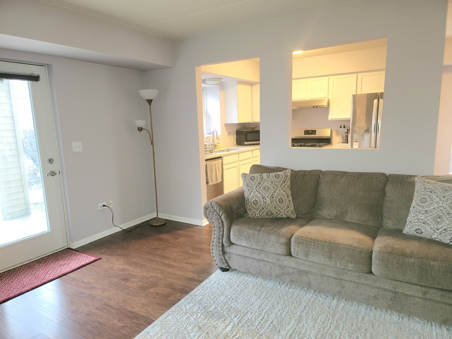237 North Mill Road, Unit 3 Addison, IL 60101 - Photo 3 of 23 a living room with furniture and a large window