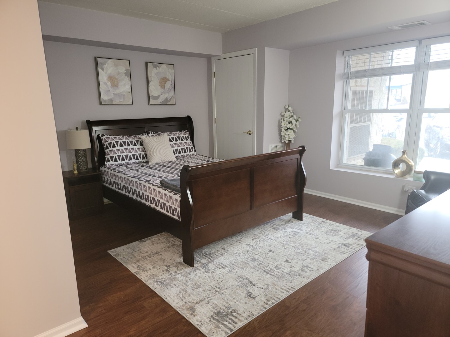 237 North Mill Road, Unit 3 Addison, IL 60101 - Photo 8 of 23 a living room with furniture and a wall painting