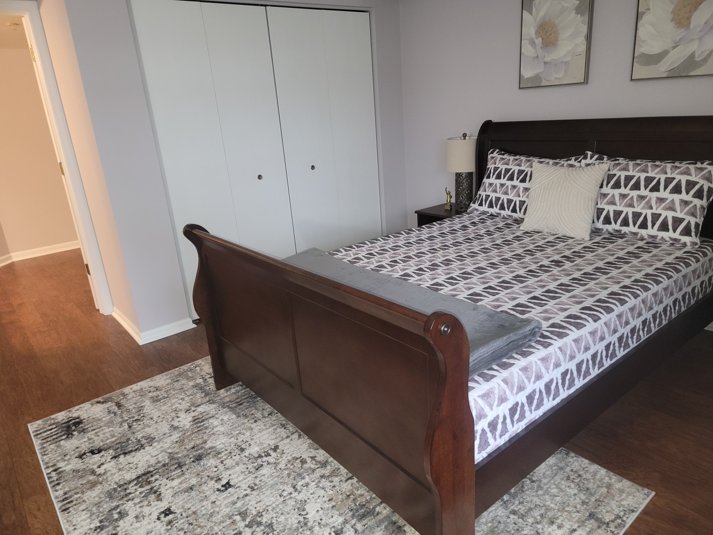 237 North Mill Road, Unit 3 Addison, IL 60101 - Photo 9 of 23 a bedroom with a bed and wooden floor