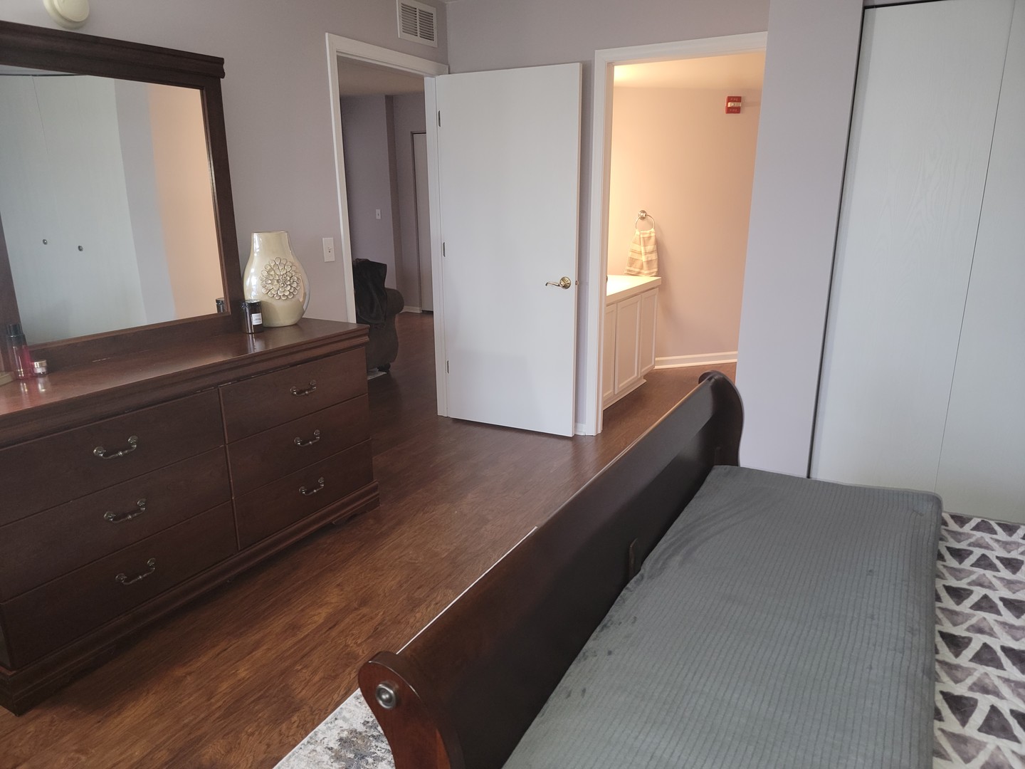237 North Mill Road, Unit 3 Addison, IL 60101 - Photo 10 of 23 a living room with a bed and a dresser