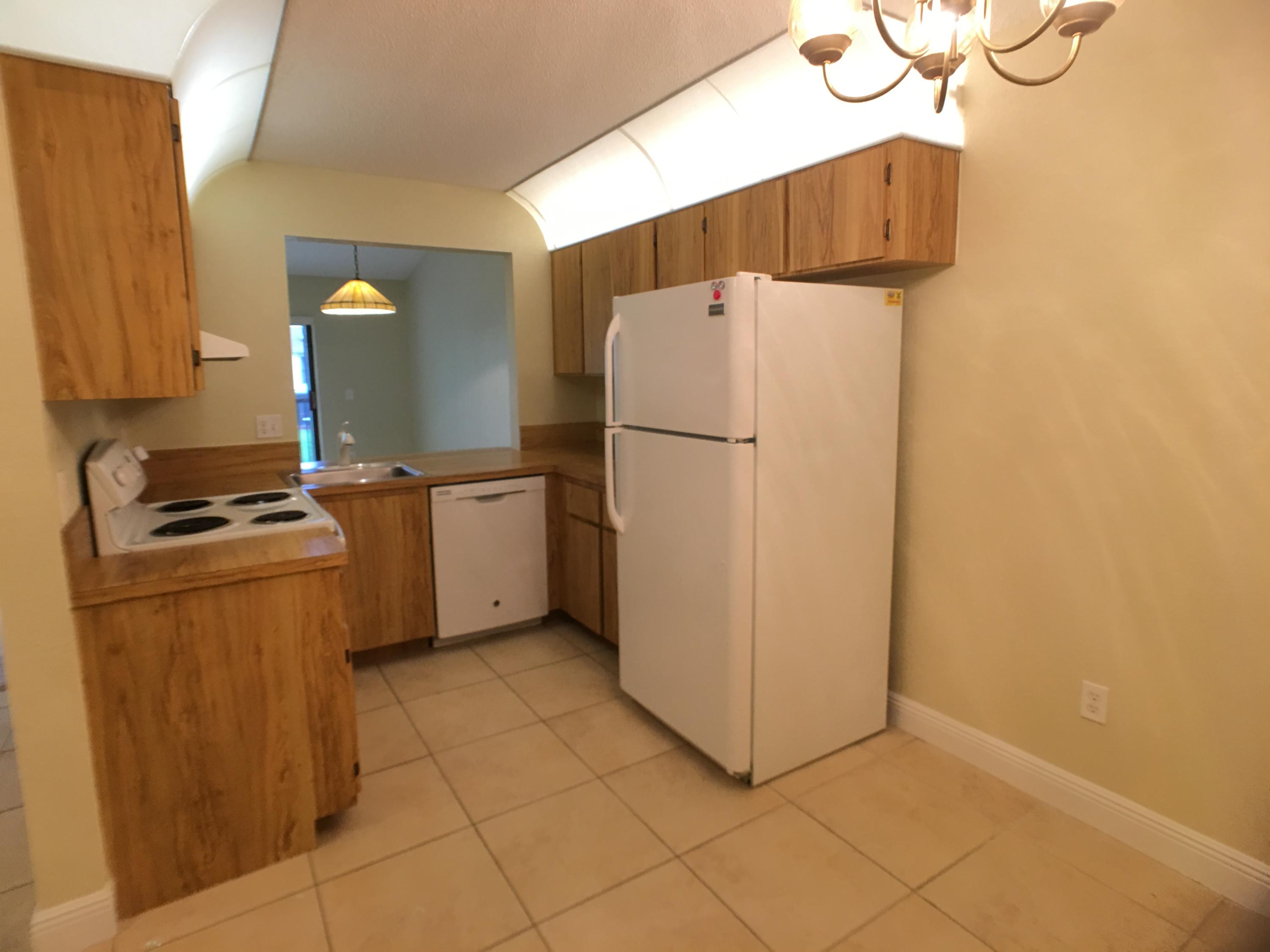 23398 Southwest 57th Avenue, Unit 309 Boca Raton, FL 33428 - Photo 12 of 29 a utility room with dryer and washer