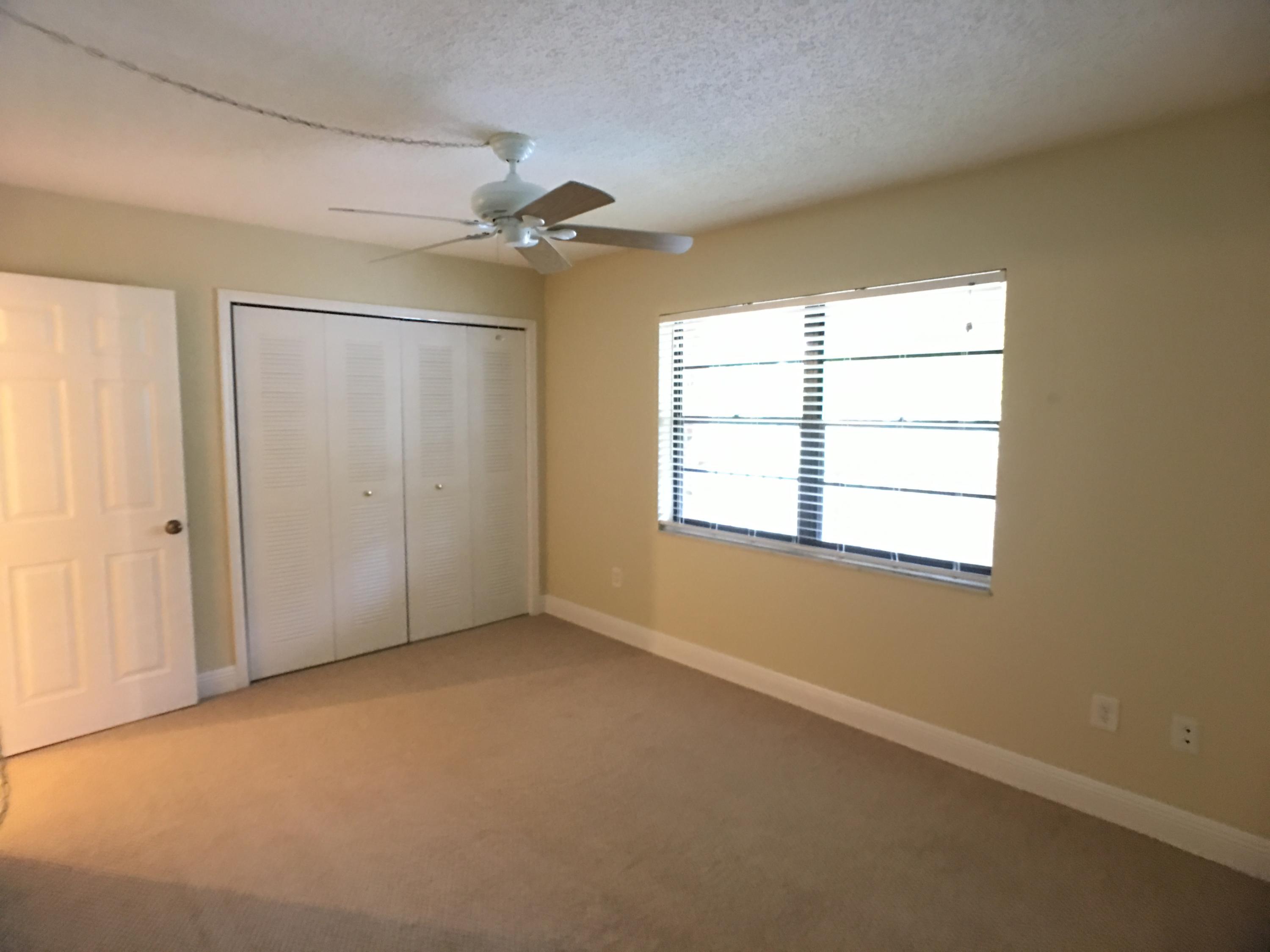 23398 Southwest 57th Avenue, Unit 309 Boca Raton, FL 33428 - Photo 14 of 29 a view of an empty room with a window
