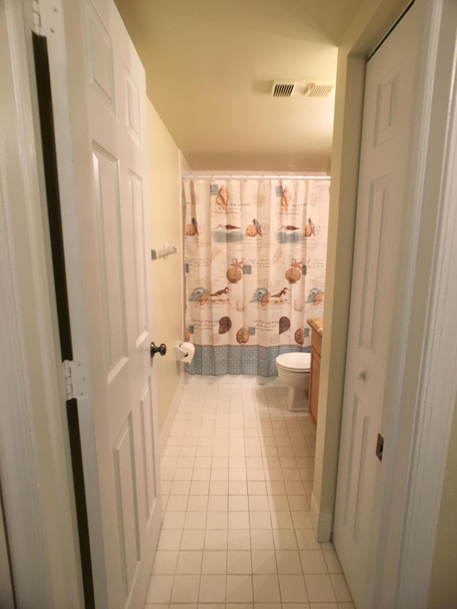 23398 Southwest 57th Avenue, Unit 309 Boca Raton, FL 33428 - Photo 16 of 29 a bathroom with a shower