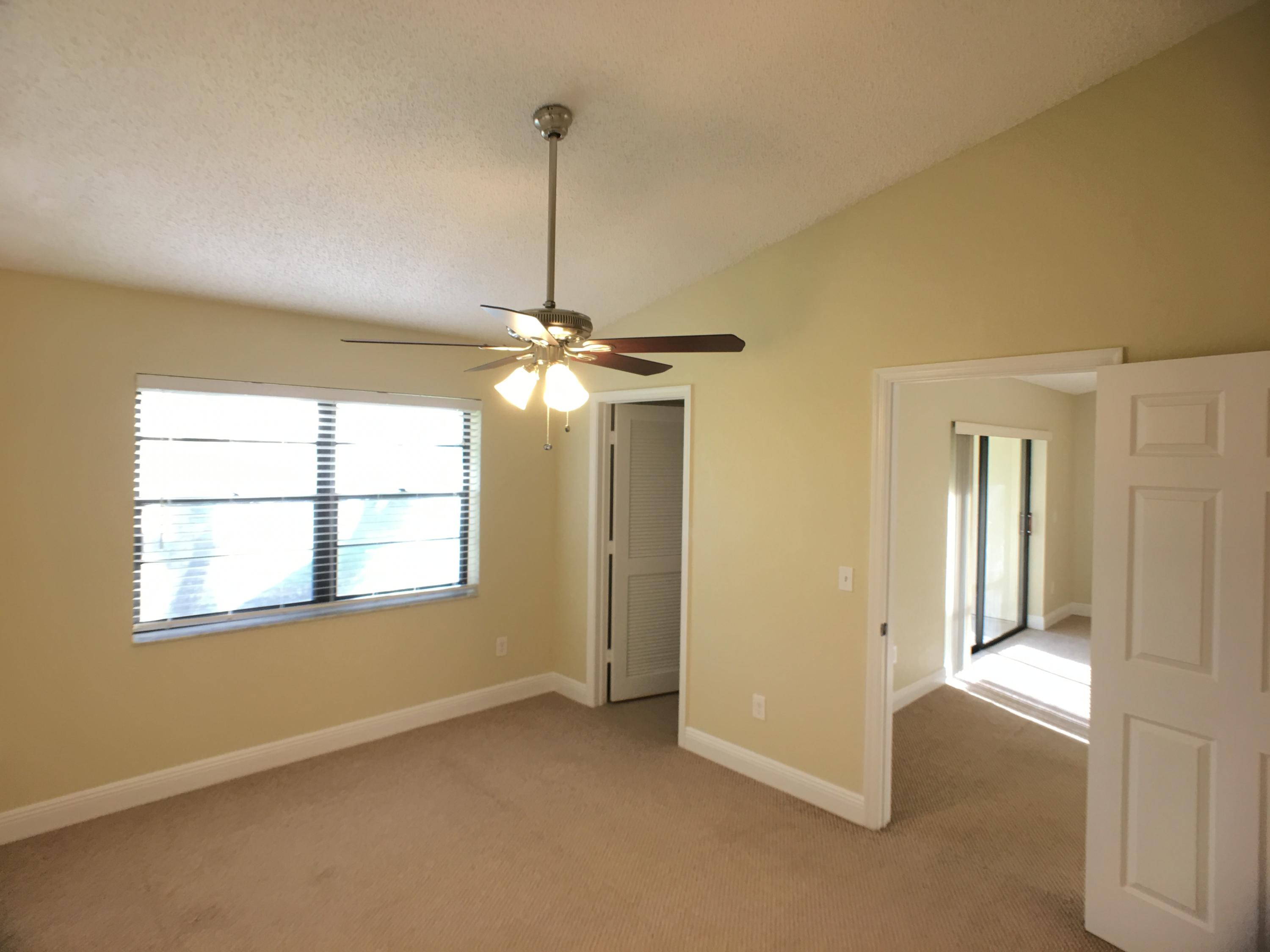 23398 Southwest 57th Avenue, Unit 309 Boca Raton, FL 33428 - Photo 21 of 29 a view of an empty room with a window