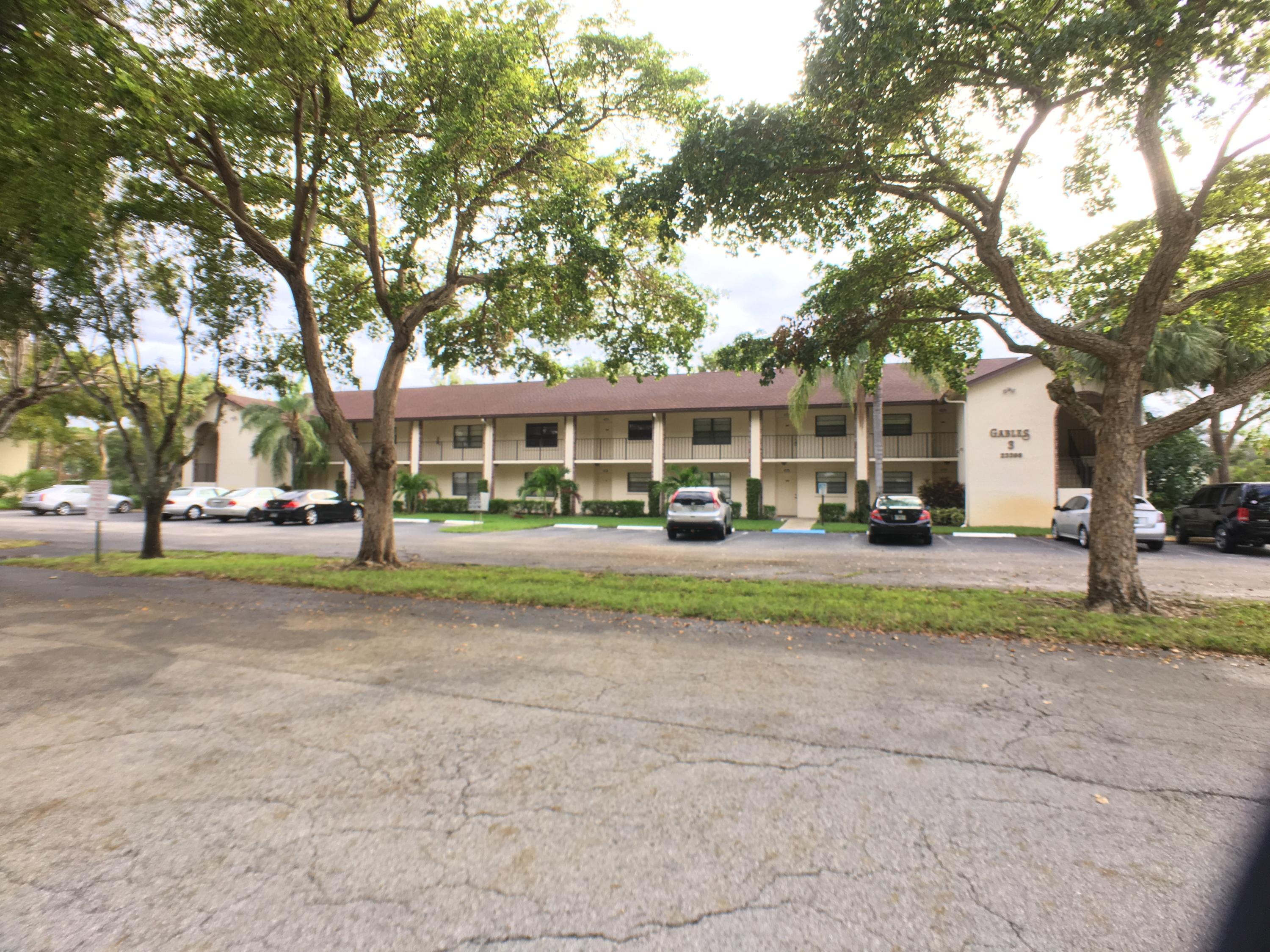23398 Southwest 57th Avenue, Unit 309 Boca Raton, FL 33428 - Photo 25 of 29 a view of a house with a yard
