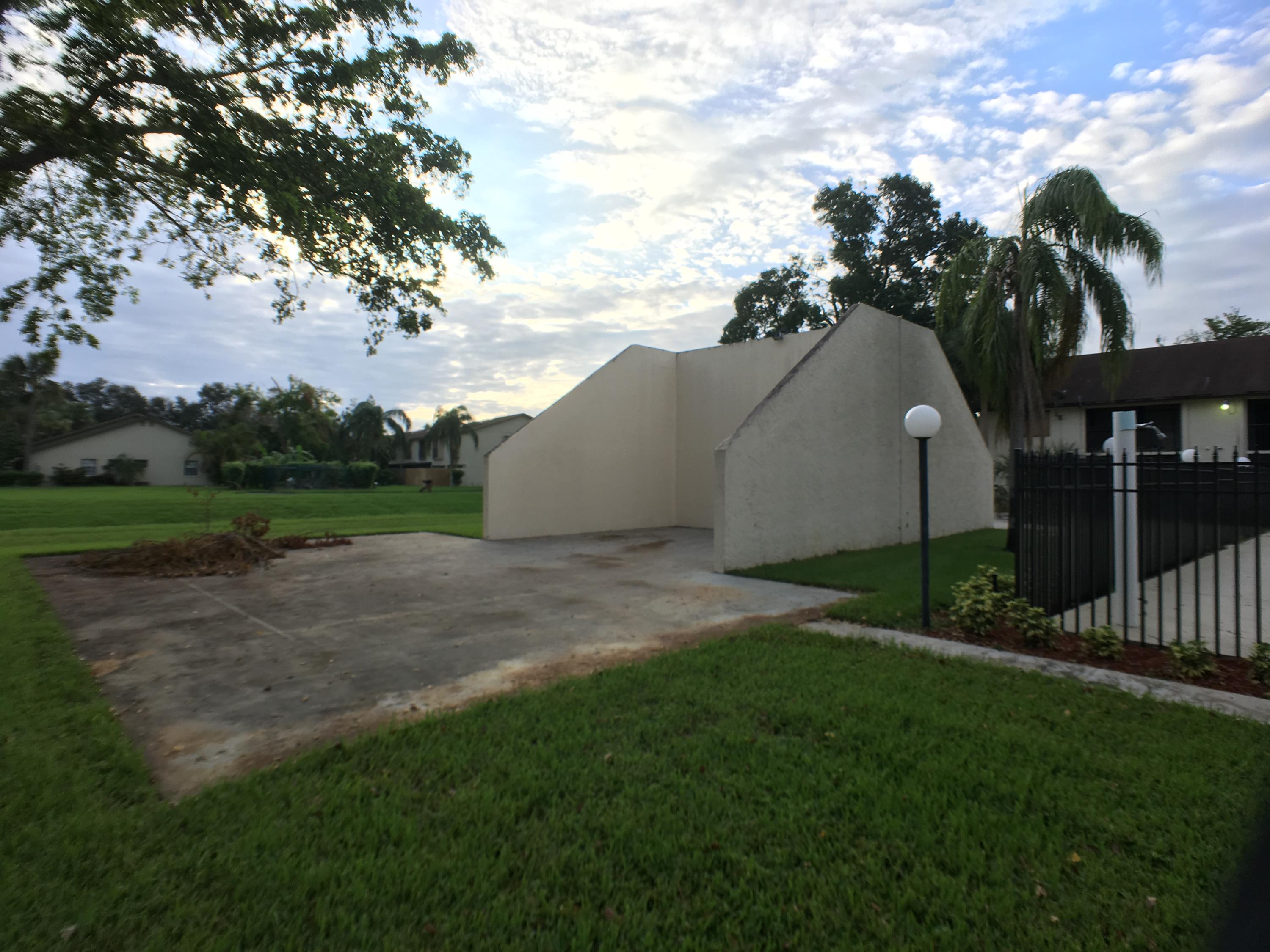 23398 Southwest 57th Avenue, Unit 309 Boca Raton, FL 33428 - Photo 28 of 29 a view of a back yard