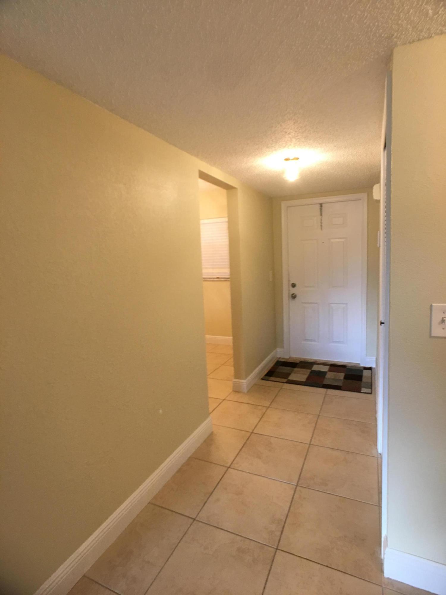 23398 Southwest 57th Avenue, Unit 309 Boca Raton, FL 33428 - Photo 3 of 29 a view of an empty room