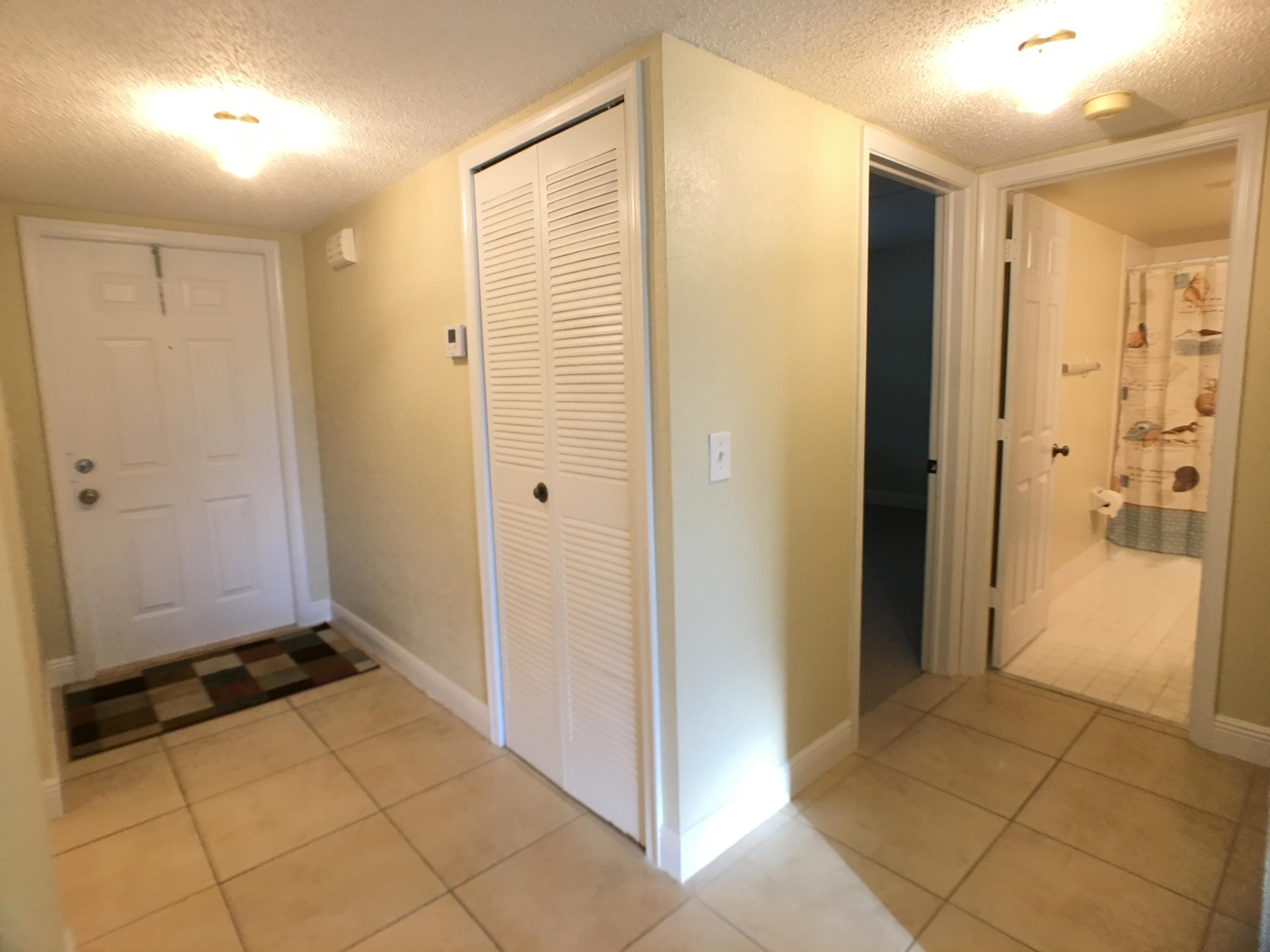 23398 Southwest 57th Avenue, Unit 309 Boca Raton, FL 33428 - Photo 4 of 29 a view of a bathroom with a shower