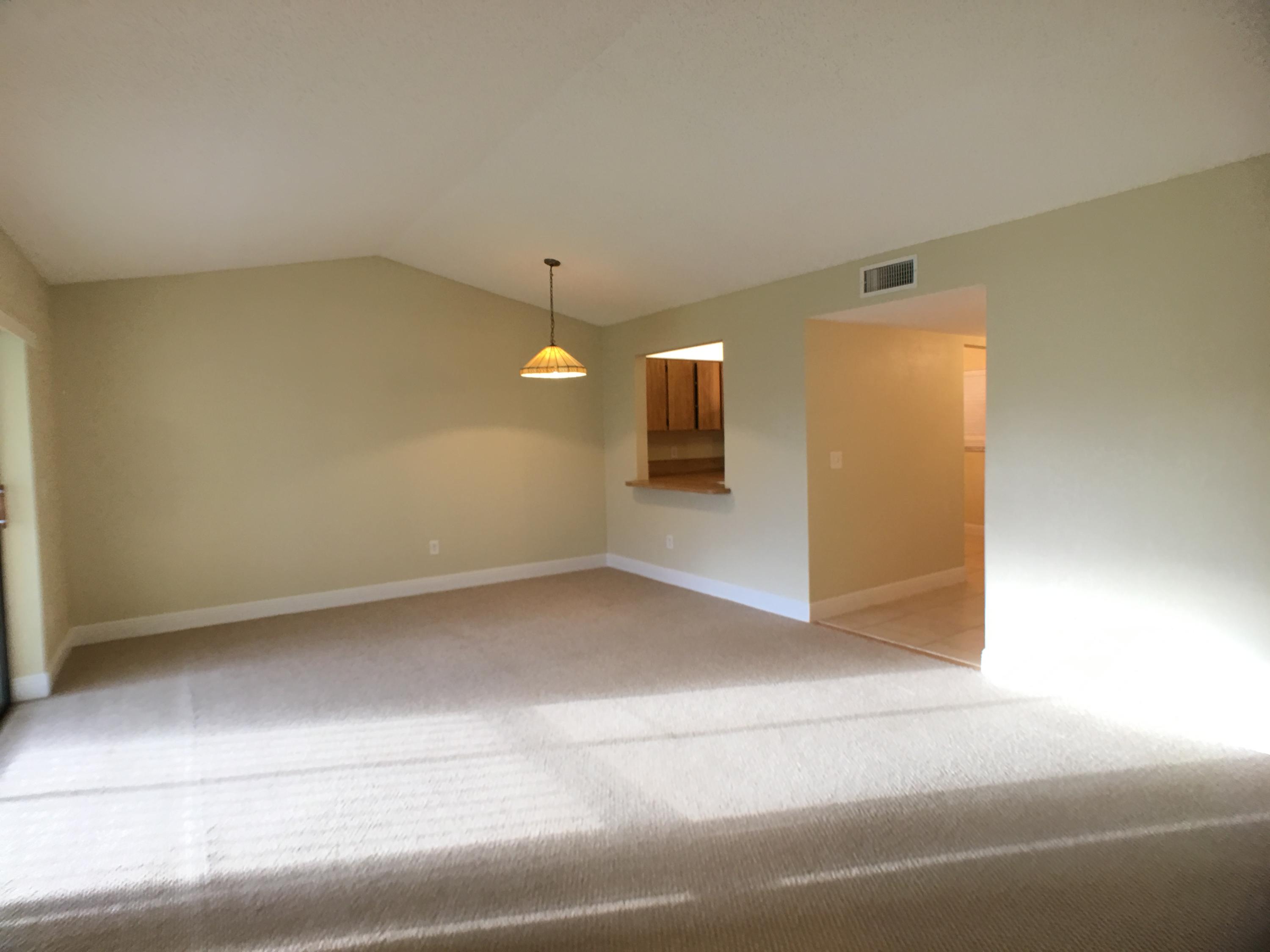 23398 Southwest 57th Avenue, Unit 309 Boca Raton, FL 33428 - Photo 5 of 29 a view of a big room with a fireplace
