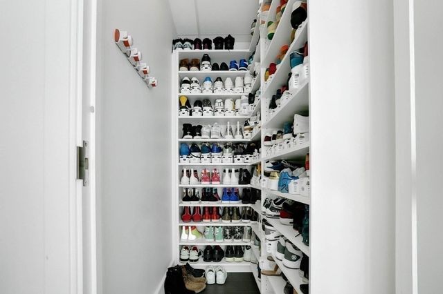 a bathroom with a toilet sink vanity and mirror