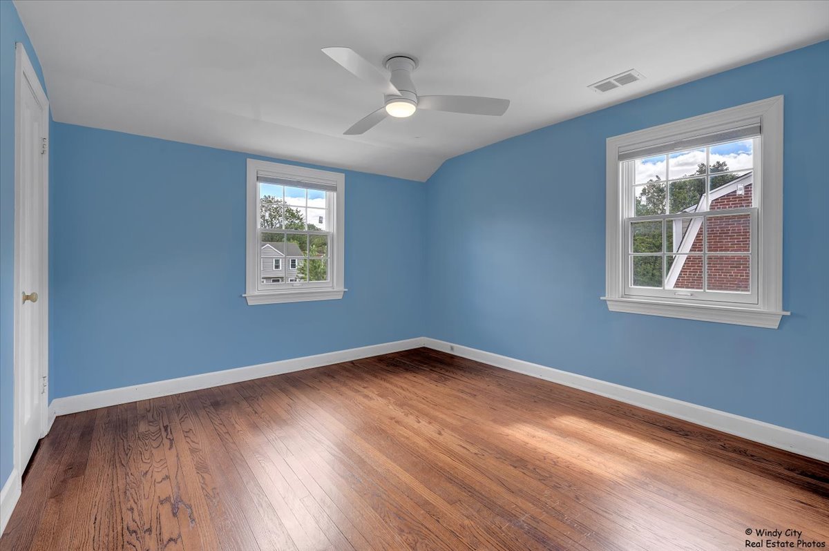 420 North Wille Street Mount Prospect, IL 60056 - Photo 17 of 28 a view of an empty room with wooden floor and a window