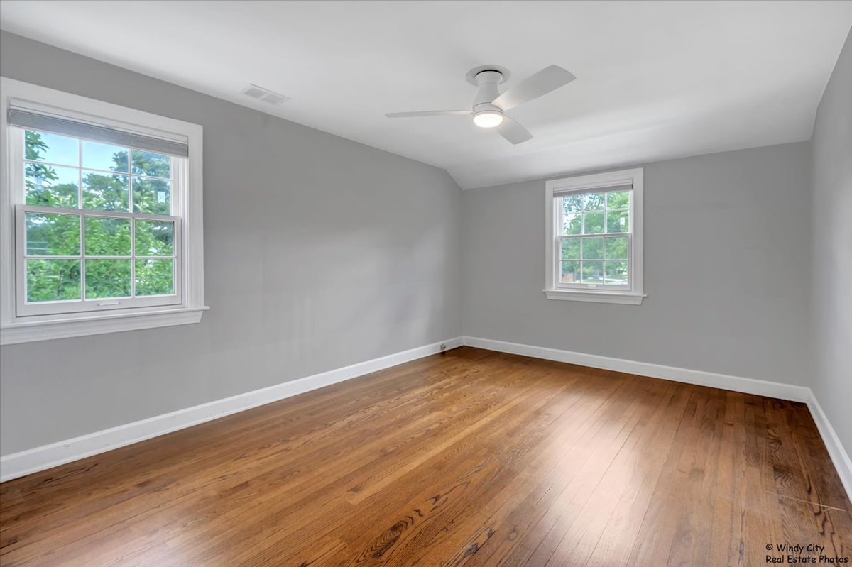 420 North Wille Street Mount Prospect, IL 60056 - Photo 18 of 28 a view of an empty room with wooden floor and a window