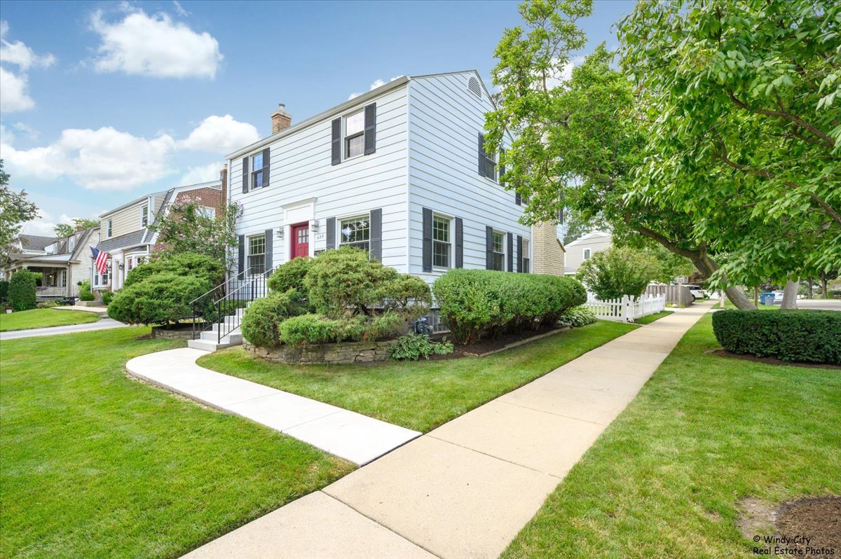 420 North Wille Street Mount Prospect, IL 60056 - Photo 2 of 28 a front view of a house with garden