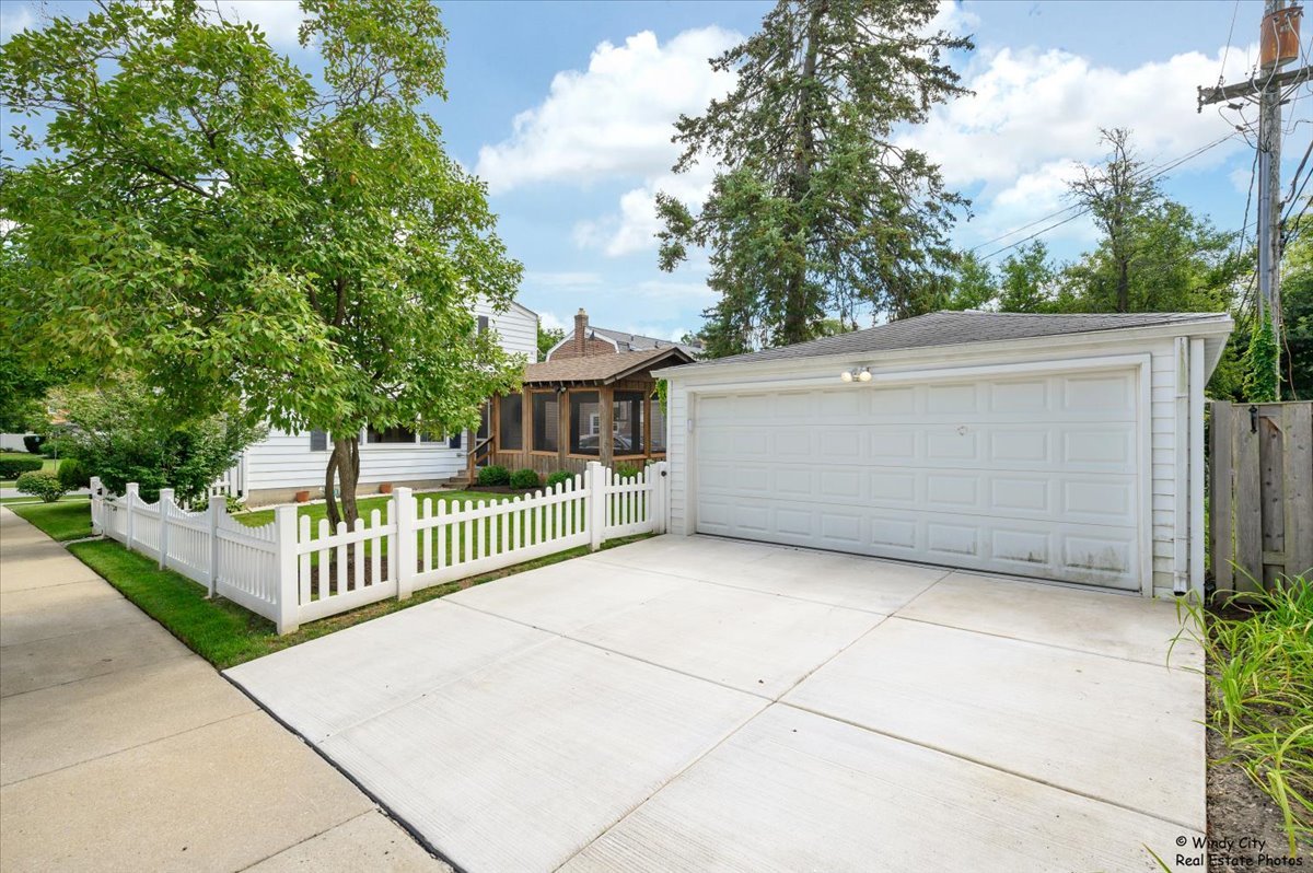 420 North Wille Street Mount Prospect, IL 60056 - Photo 24 of 28 a view of a wrought iron fences in front of house