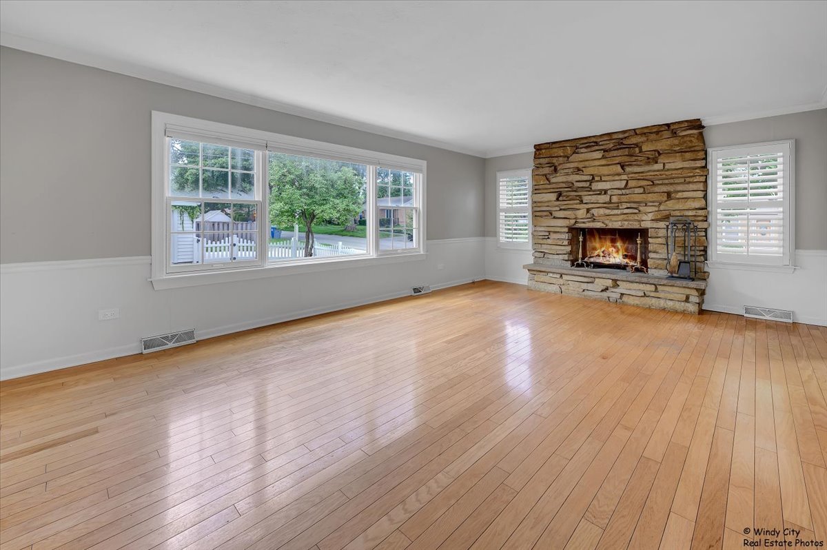 420 North Wille Street Mount Prospect, IL 60056 - Photo 6 of 28 wooden floor fireplace and windows in an empty room