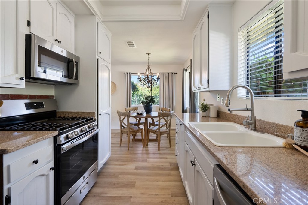 10 Flag Way, Unit C Paso Robles, CA 93446 - Photo 10 of 32 a kitchen with granite countertop lots of counter top space and stainless steel appliances