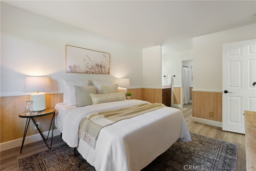 10 Flag Way, Unit C Paso Robles, CA 93446 - Photo 13 of 32 a bed room with a bed and a lamp