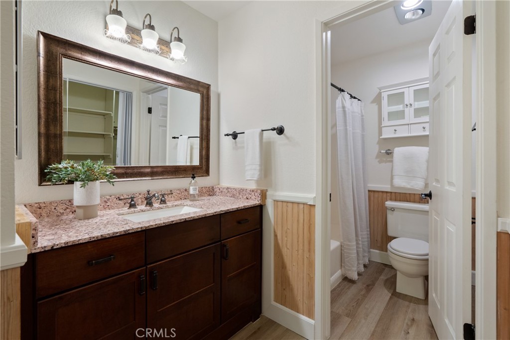 10 Flag Way, Unit C Paso Robles, CA 93446 - Photo 15 of 32 a bathroom with a sink vanity granite and a toilet