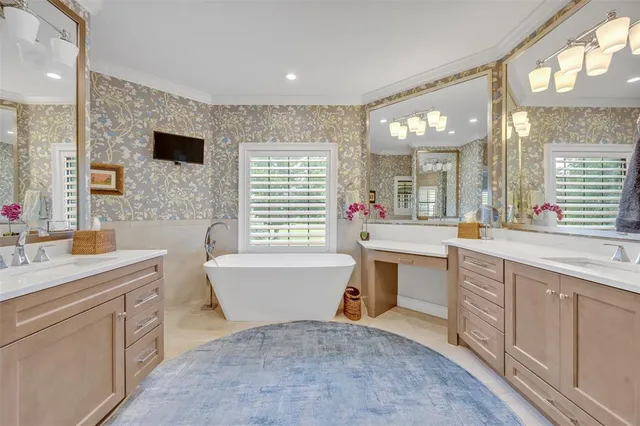 a large bathroom with a sink mirror and a bathtub
