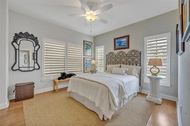 a bedroom with a bed and a lamp with window