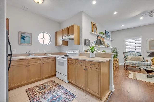 a spacious bathroom with a granite countertop sink a mirror and a