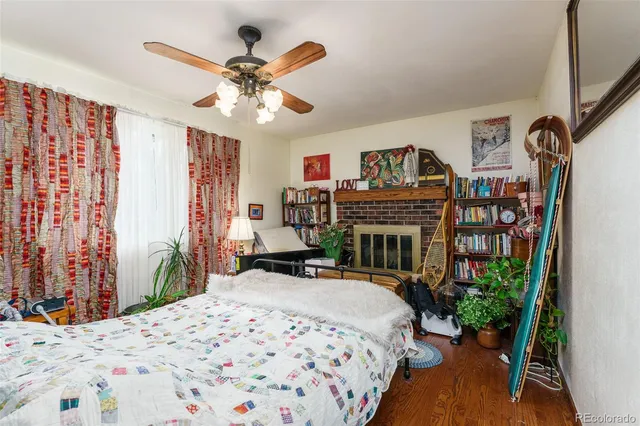 a bedroom that has a bed and a chandelier