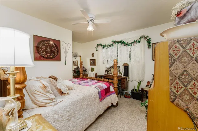 a living room with furniture and flowers
