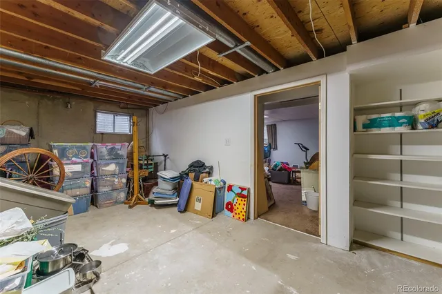 a bathroom with a toilet a sink and a mirror