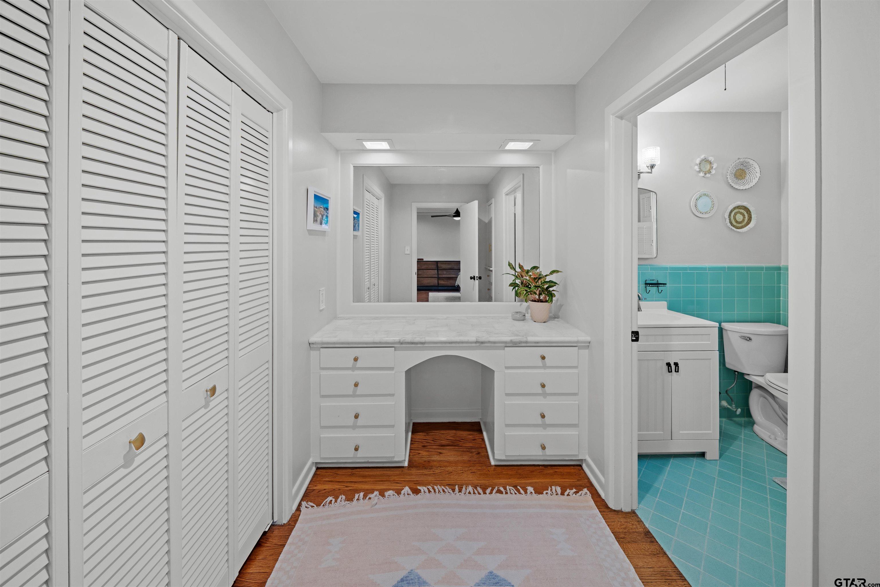 917 Rhodes Drive Tyler, TX 75701 - Photo 16 of 27 a spacious bathroom with a bathtub and a sink