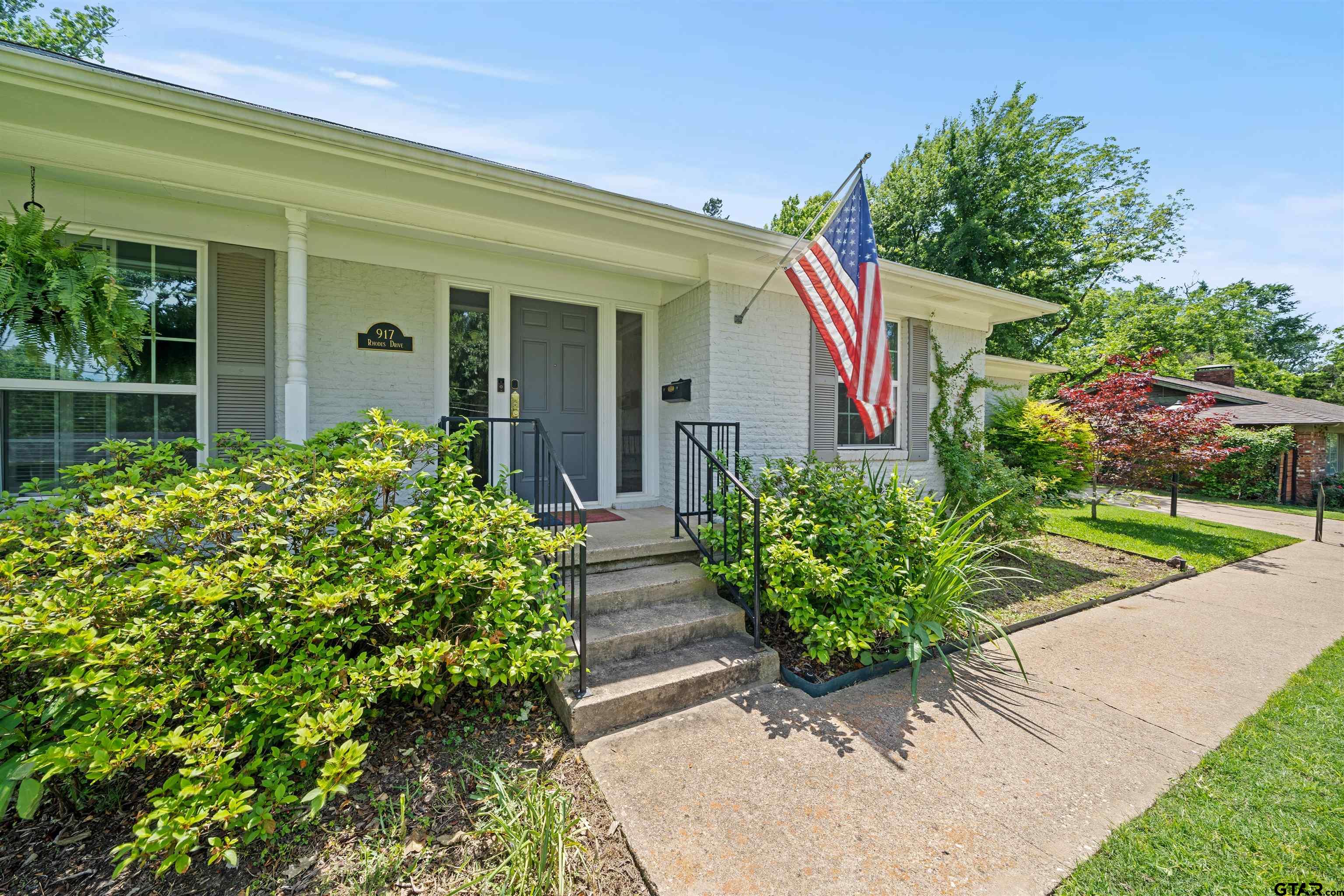 917 Rhodes Drive Tyler, TX 75701 - Photo 2 of 27 a front view of a house with garden